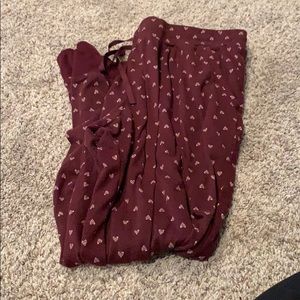Maroon joggers with white hearts